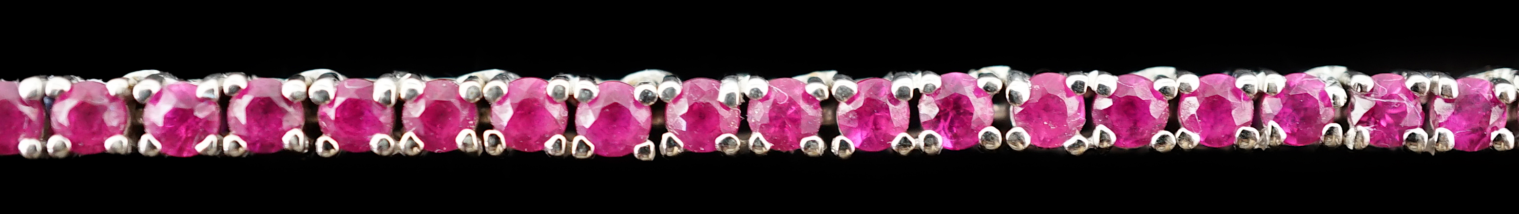 A modern 18k white gold and ruby set line necklace
